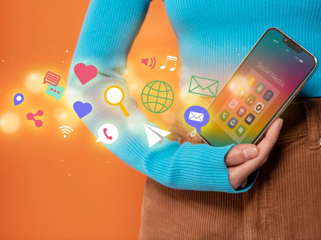Person holding a smartphone with floating social media icons, representing digital marketing in Malaysia.