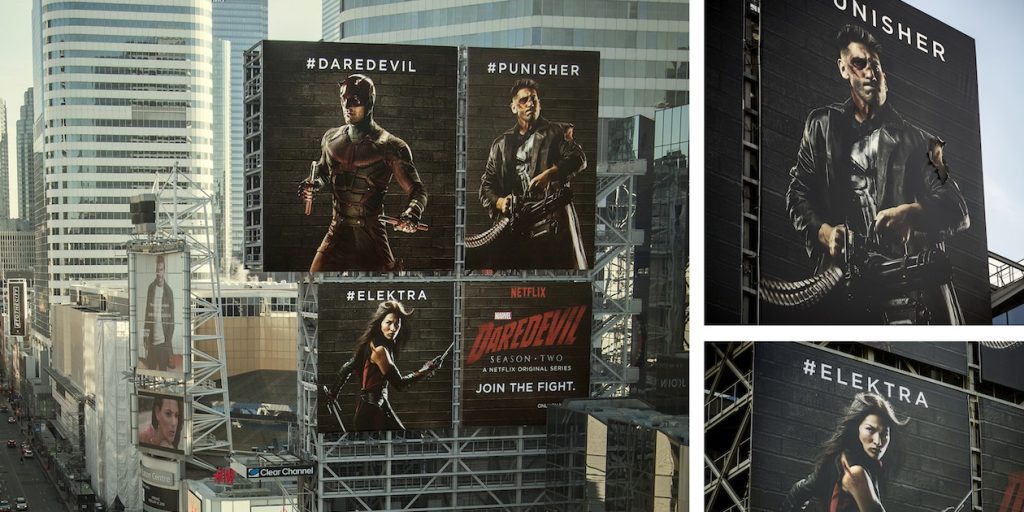 Billboard advertising for Netflix's Marvel series featuring Daredevil, Punisher, and Elektra. Multiple large-scale billboards highlight characters and the tagline 'Join the Fight' to promote Daredevil Season 2, displayed in an urban setting with high-rise buildings.