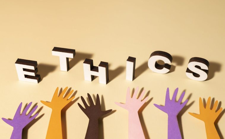 Colorful hands reaching up towards 3D letters spelling 'ETHICS,' symbolizing the importance of ethical marketing practices and inclusive business values.