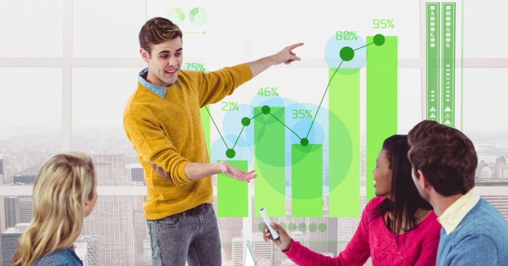 Team analyzing a digital marketing strategy with interactive graphs and charts in a modern office setting, focusing on growth and audience engagement.